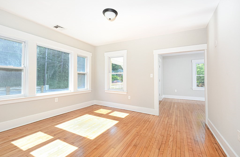 230 Southbridge Road Charlton, MA 01507 - Photo 17 of 35 an empty room with wooden floor and windows