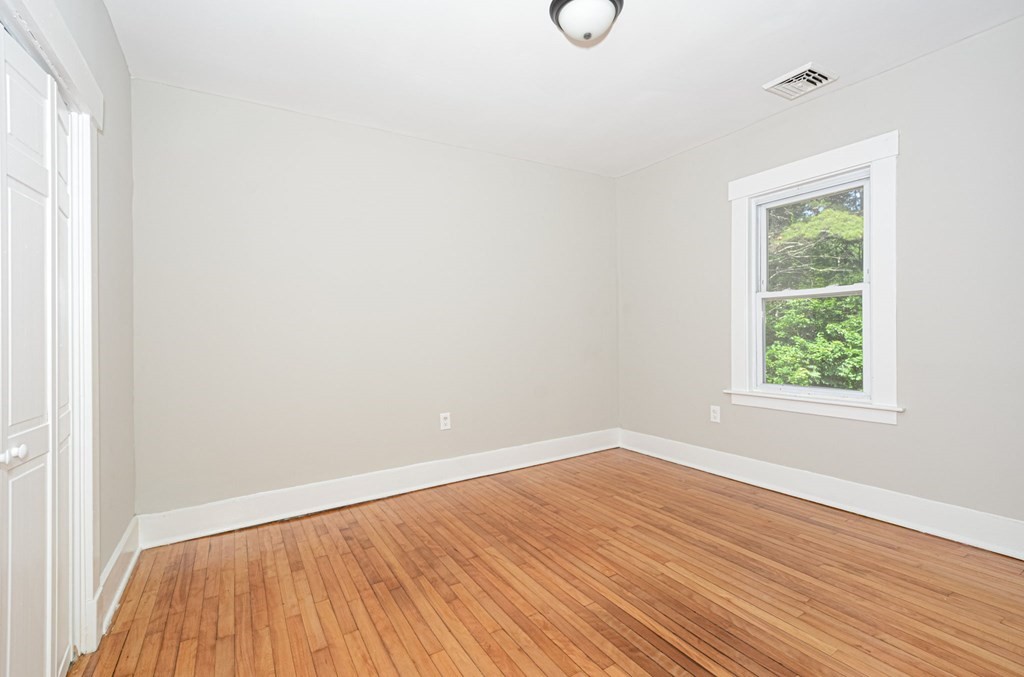 230 Southbridge Road Charlton, MA 01507 - Photo 22 of 35 an empty room with wooden floor and windows