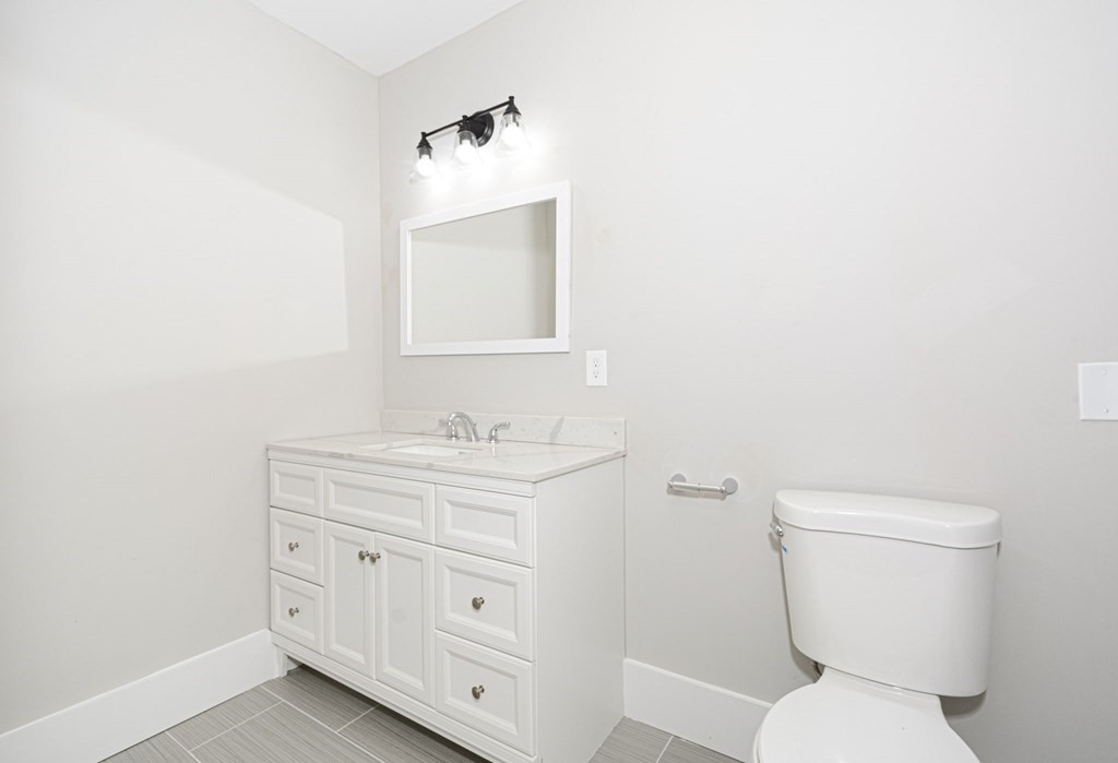 230 Southbridge Road Charlton, MA 01507 - Photo 25 of 35 a bathroom with a toilet sink and mirror