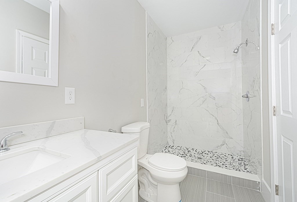 230 Southbridge Road Charlton, MA 01507 - Photo 26 of 35 a bathroom with a sink toilet and shower
