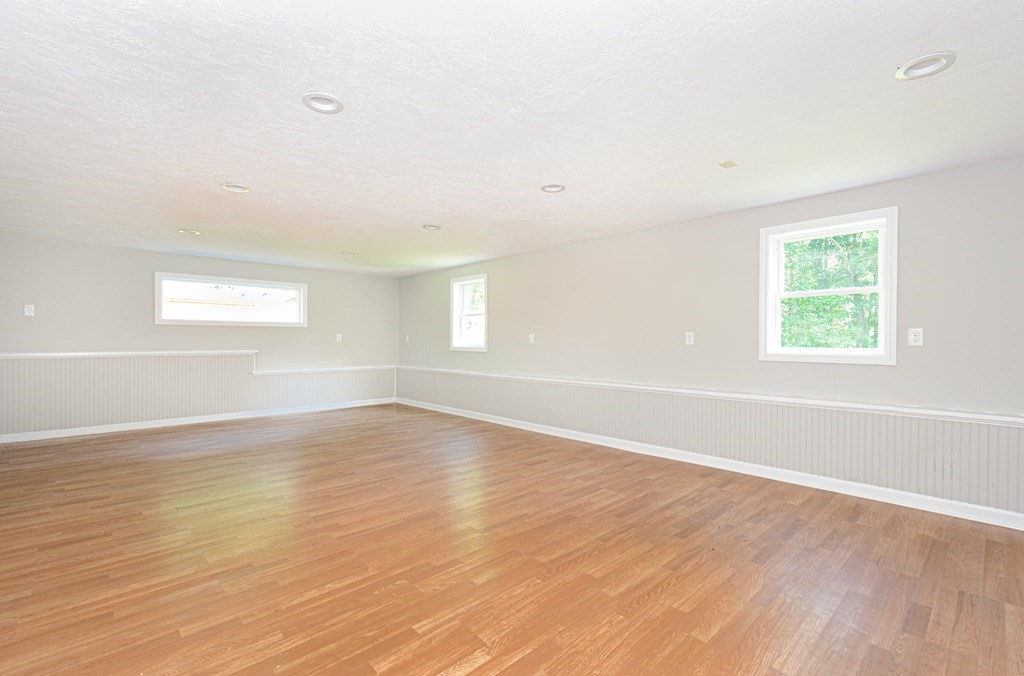 230 Southbridge Road Charlton, MA 01507 - Photo 33 of 35 an empty room with wooden floor and windows