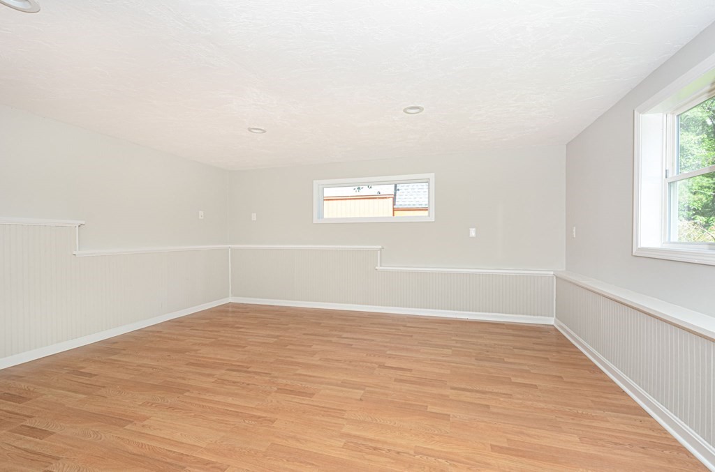 230 Southbridge Road Charlton, MA 01507 - Photo 34 of 35 an empty room with wooden floor and windows