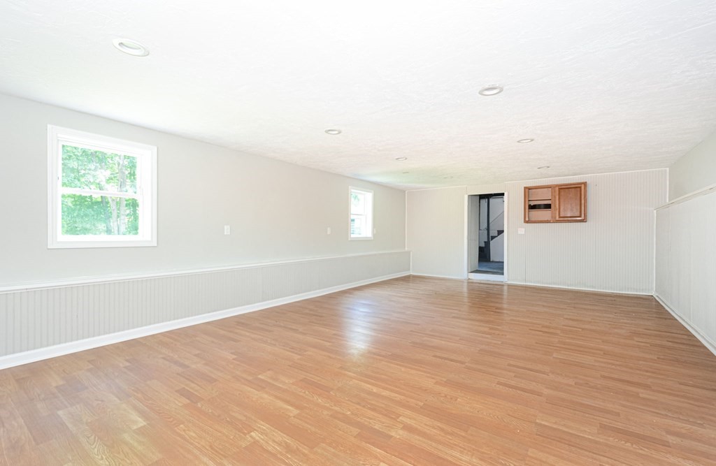 230 Southbridge Road Charlton, MA 01507 - Photo 35 of 35 an empty room with wooden floor and windows