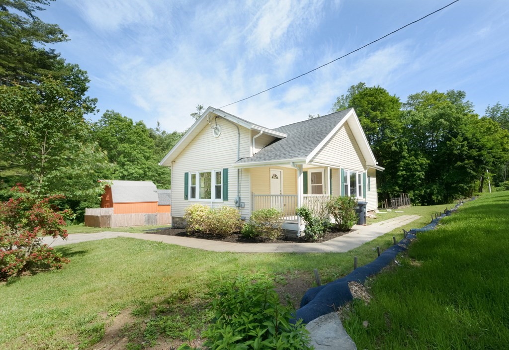 230 Southbridge Road Charlton, MA 01507 - Photo 4 of 35 a front view of a house with garden