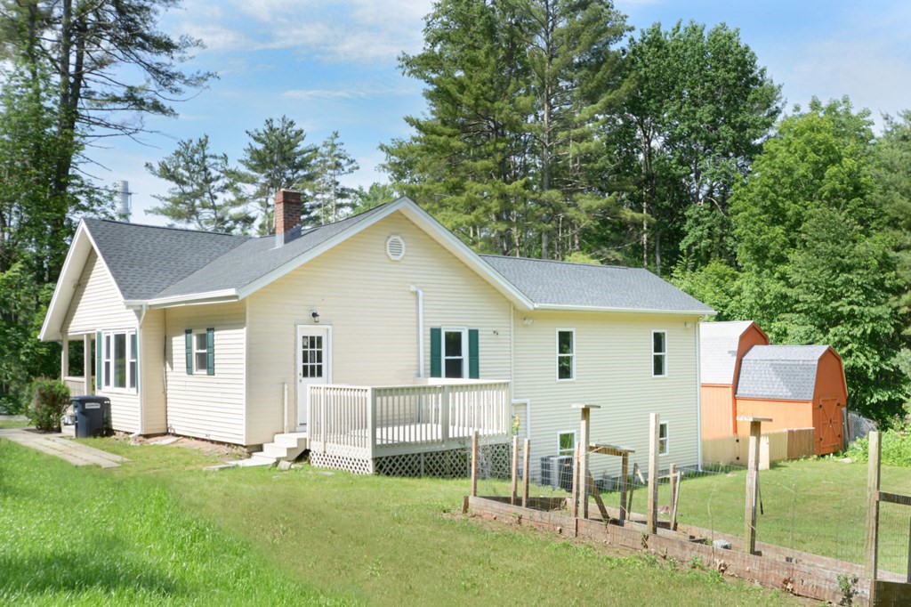 230 Southbridge Road Charlton, MA 01507 - Photo 7 of 35 a view of a house with a yard and porch
