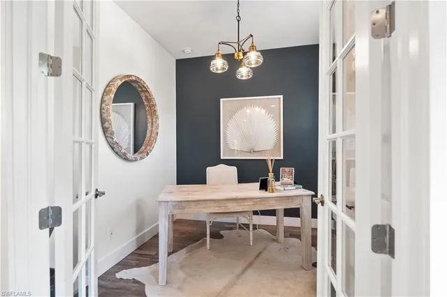 a kitchen with appliances a stove and cabinets