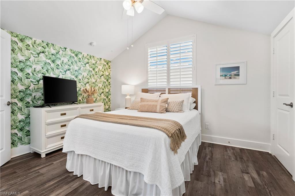 3060 Woodside Avenue Naples, FL 34112 - Photo 18 of 36 a bedroom with a bed and a flat screen tv
