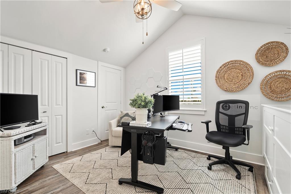3060 Woodside Avenue Naples, FL 34112 - Photo 19 of 36 a view of a workspace with furniture and a window