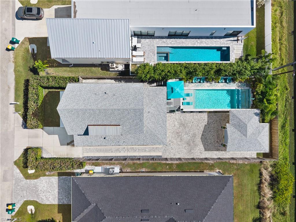 3060 Woodside Avenue Naples, FL 34112 - Photo 27 of 36 an aerial view of a house with a swimming pool