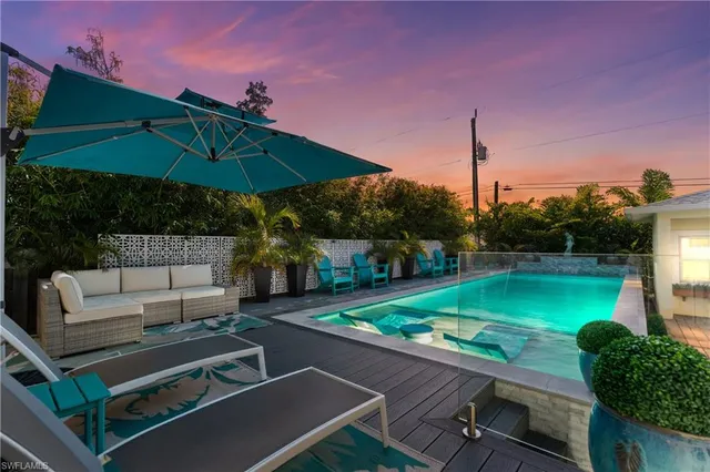 an aerial view of a house with a swimming pool
