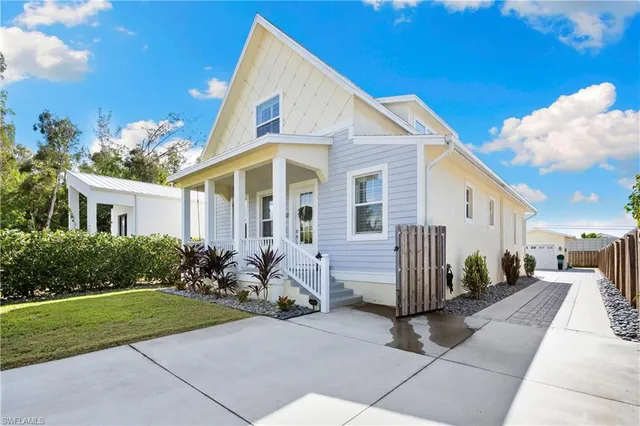 a view of a backyard with sitting area