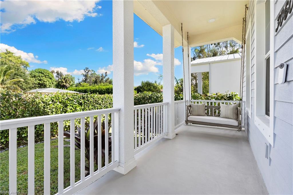 3060 Woodside Avenue Naples, FL 34112 - Photo 5 of 36 a view of a porch with furniture
