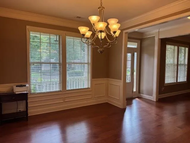 a view of a livingroom with wooden floor