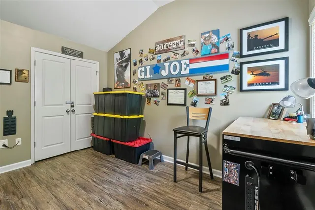a room with furniture and wooden floor