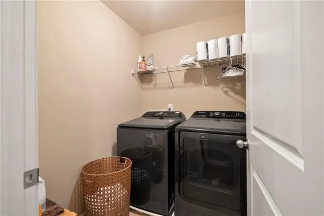 a utility room with dryer and washer