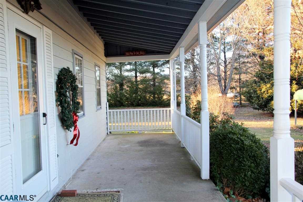 980 Shelby Road Madison, VA 22727 - Photo 6 of 36 a view of porch with large trees and plants