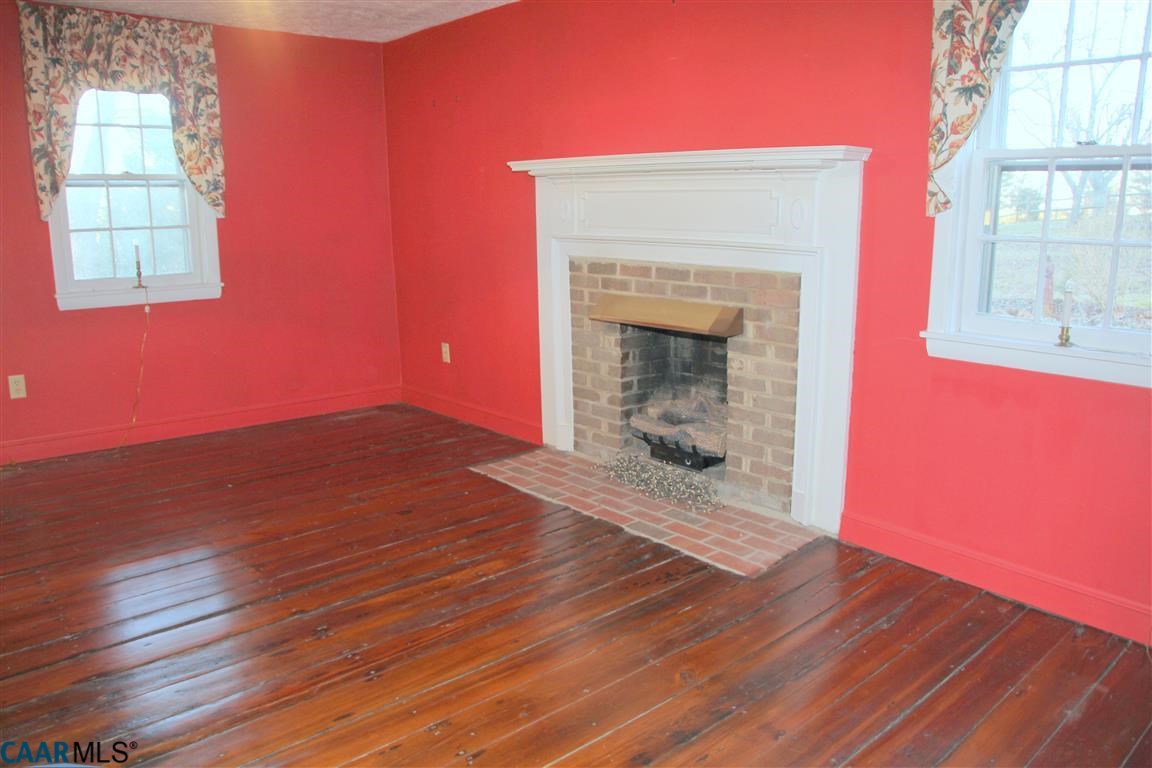 980 Shelby Road Madison, VA 22727 - Photo 10 of 36 a view of a room with wooden floors and fireplace