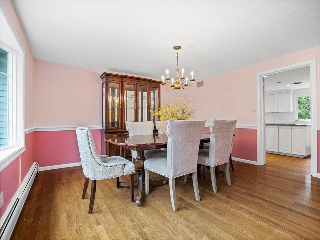 110 Glen Road Wellesley, MA 02481 - Photo 12 of 22 a dining room with furniture wooden floor a rug and a chandelier