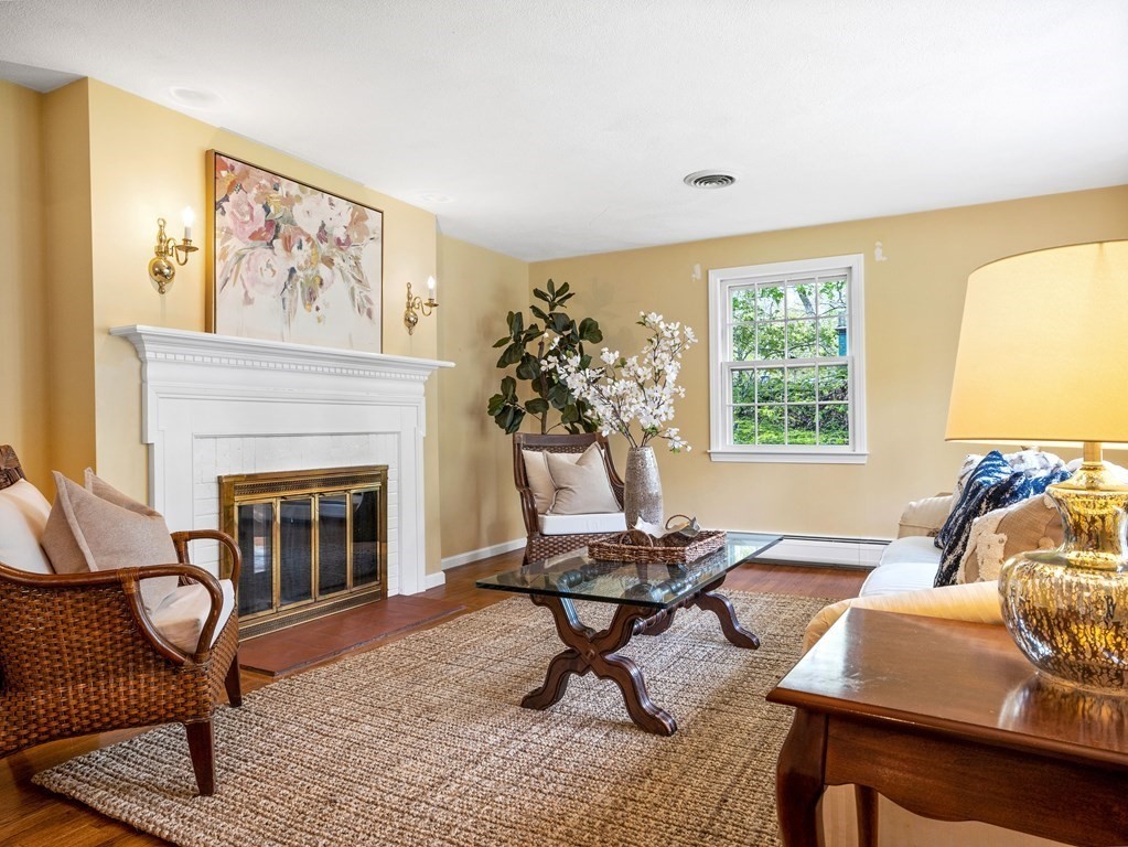 110 Glen Road Wellesley, MA 02481 - Photo 5 of 22 a living room with furniture a fireplace and a window