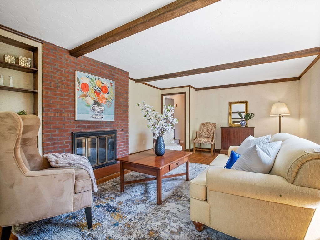 110 Glen Road Wellesley, MA 02481 - Photo 6 of 22 a living room with furniture and a fireplace