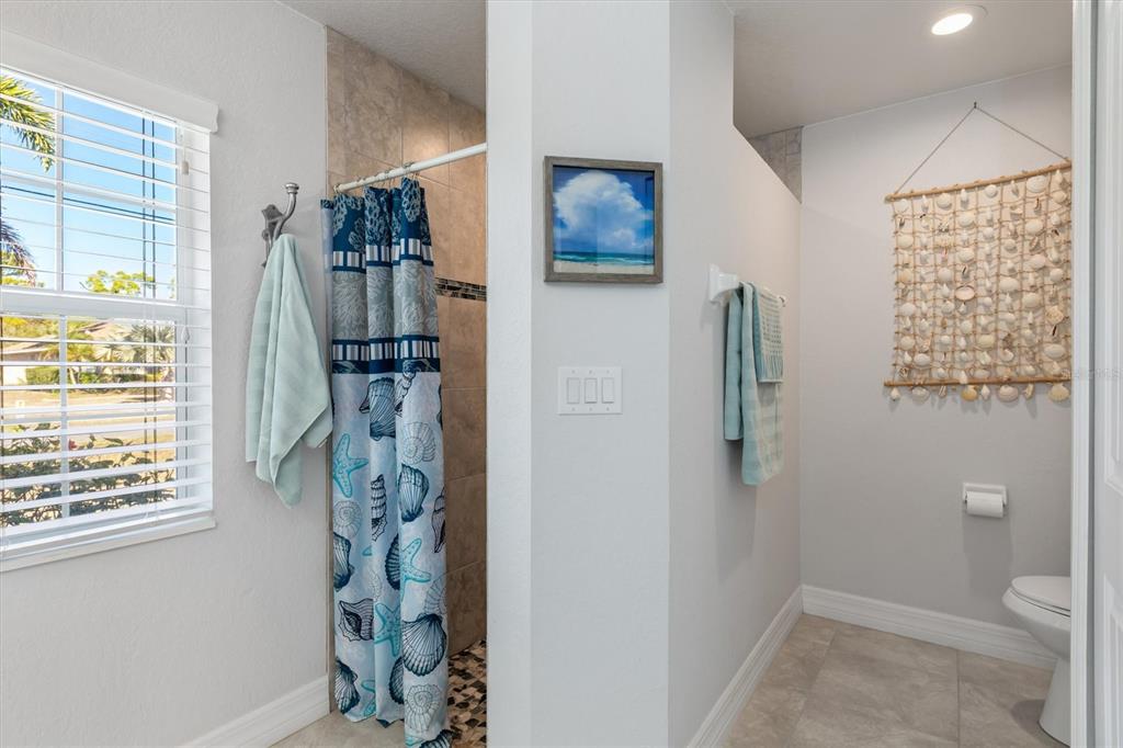 259 Marker Road Rotonda West, FL 33947 - Photo 15 of 37 a bathroom with a toilet and a shower