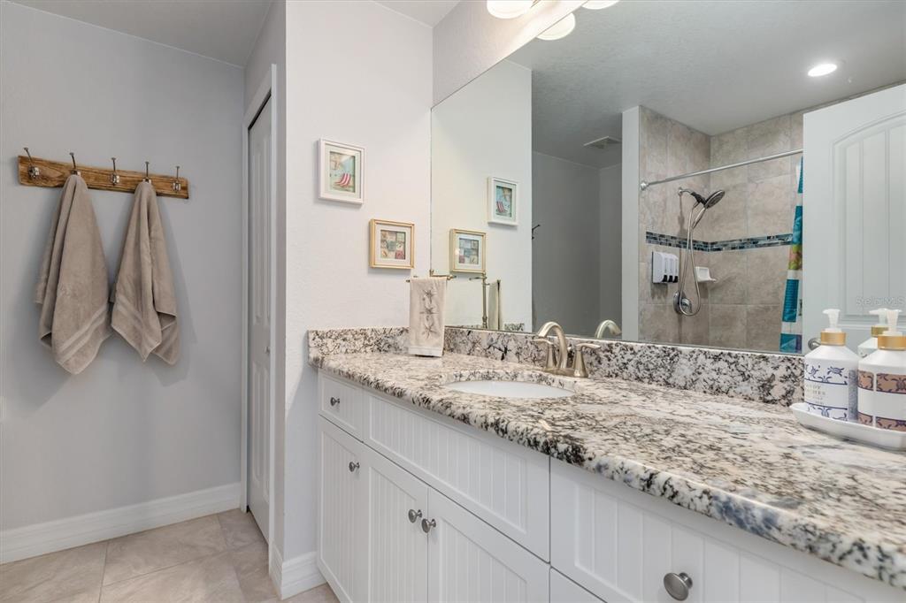 259 Marker Road Rotonda West, FL 33947 - Photo 19 of 37 a bathroom with a sink and a mirror