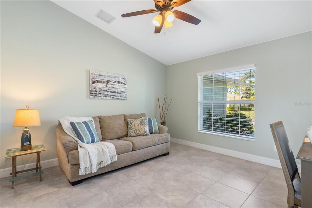 259 Marker Road Rotonda West, FL 33947 - Photo 21 of 37 a living room with furniture and a window