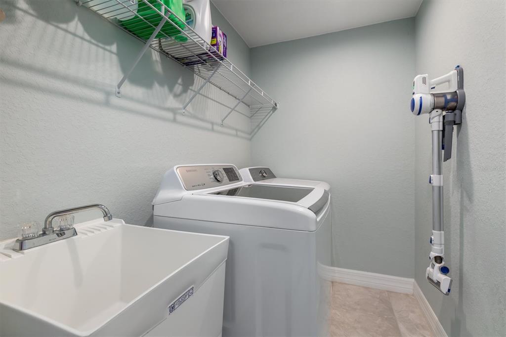 259 Marker Road Rotonda West, FL 33947 - Photo 22 of 37 a utility room with dryer and washer