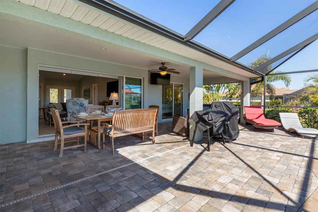 259 Marker Road Rotonda West, FL 33947 - Photo 26 of 37 a view of a chairs and table in a patio