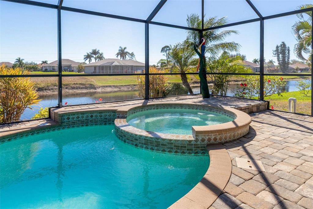 259 Marker Road Rotonda West, FL 33947 - Photo 27 of 37 a view of a swimming pool with a lake view