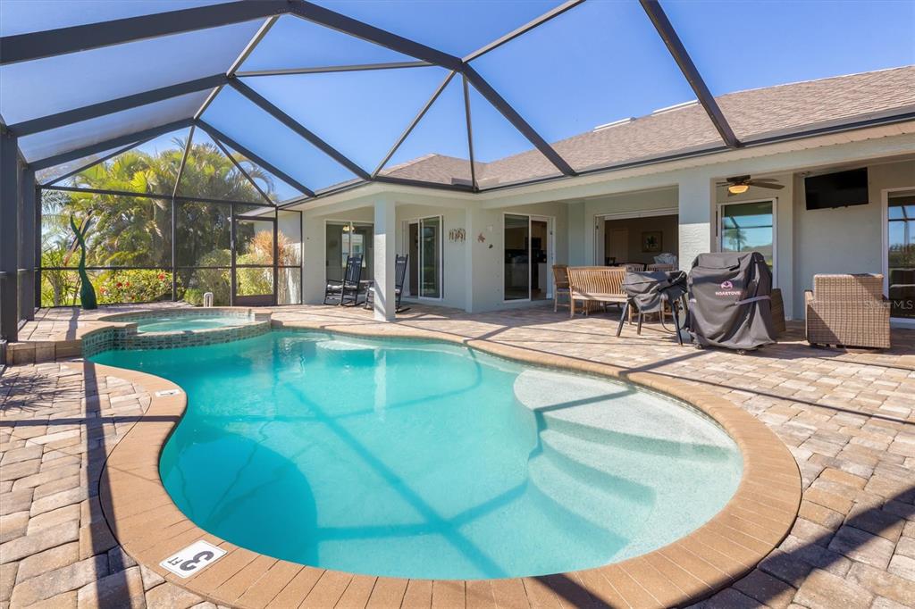 259 Marker Road Rotonda West, FL 33947 - Photo 28 of 37 a view of a swimming pool with an outdoor seating