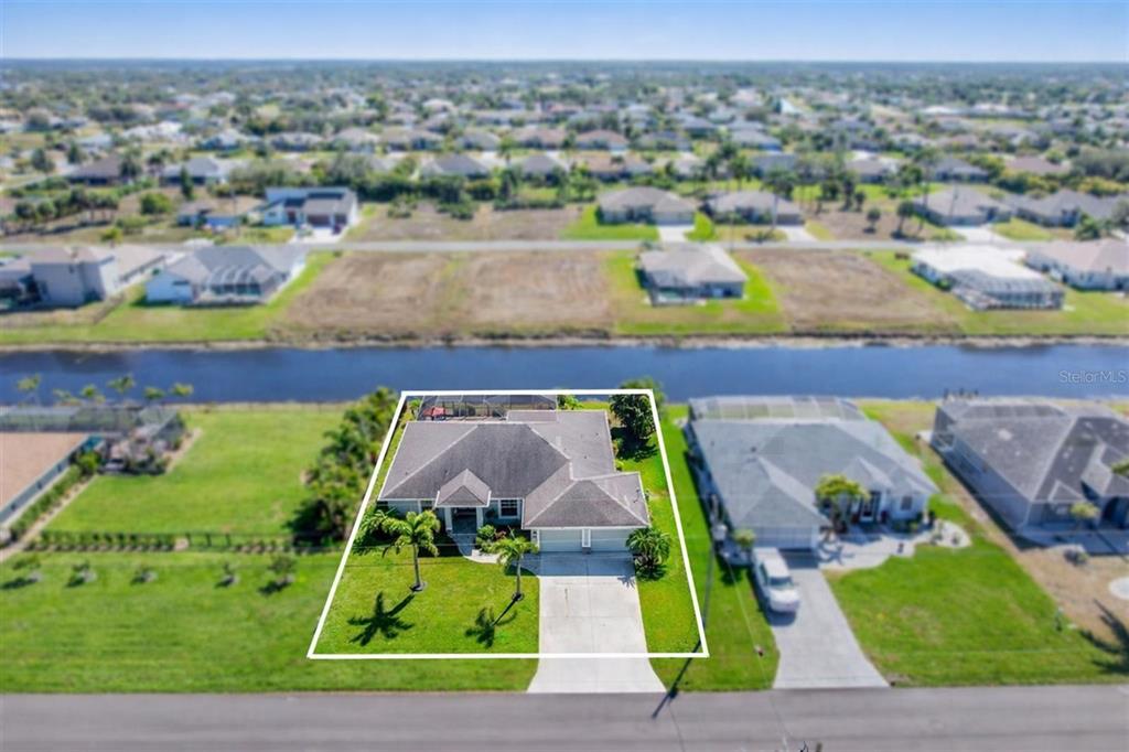 259 Marker Road Rotonda West, FL 33947 - Photo 31 of 37 an aerial view of a house with a garden