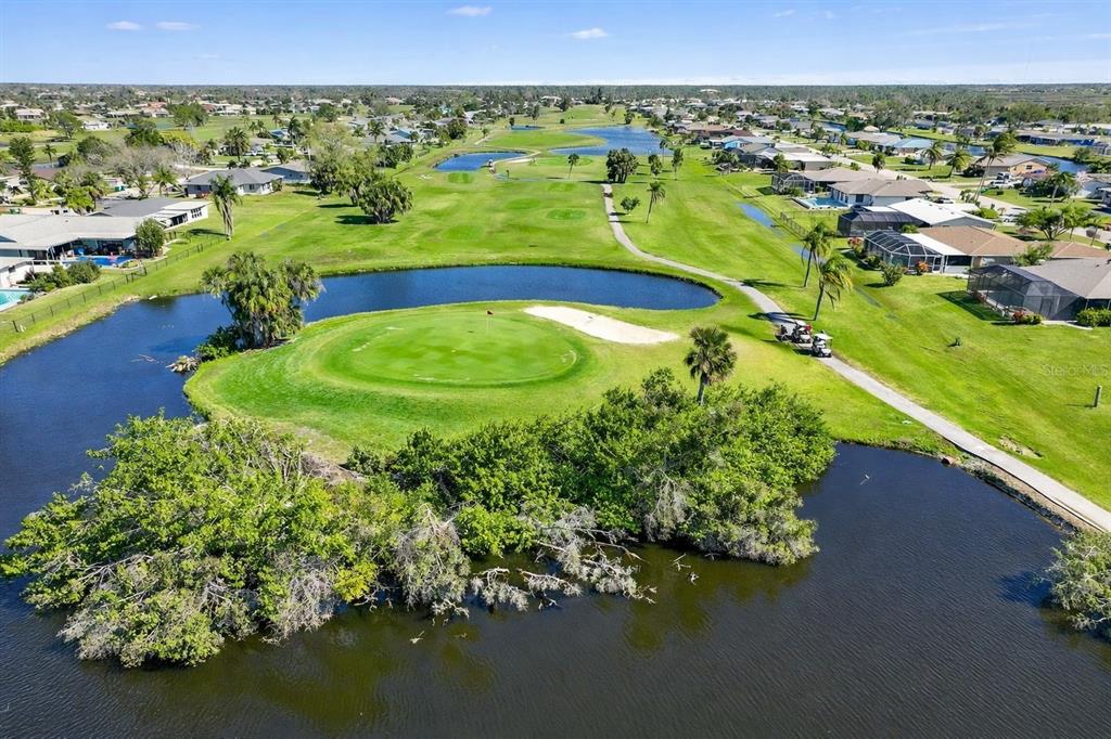 259 Marker Road Rotonda West, FL 33947 - Photo 36 of 37 a view of a garden with an ocean