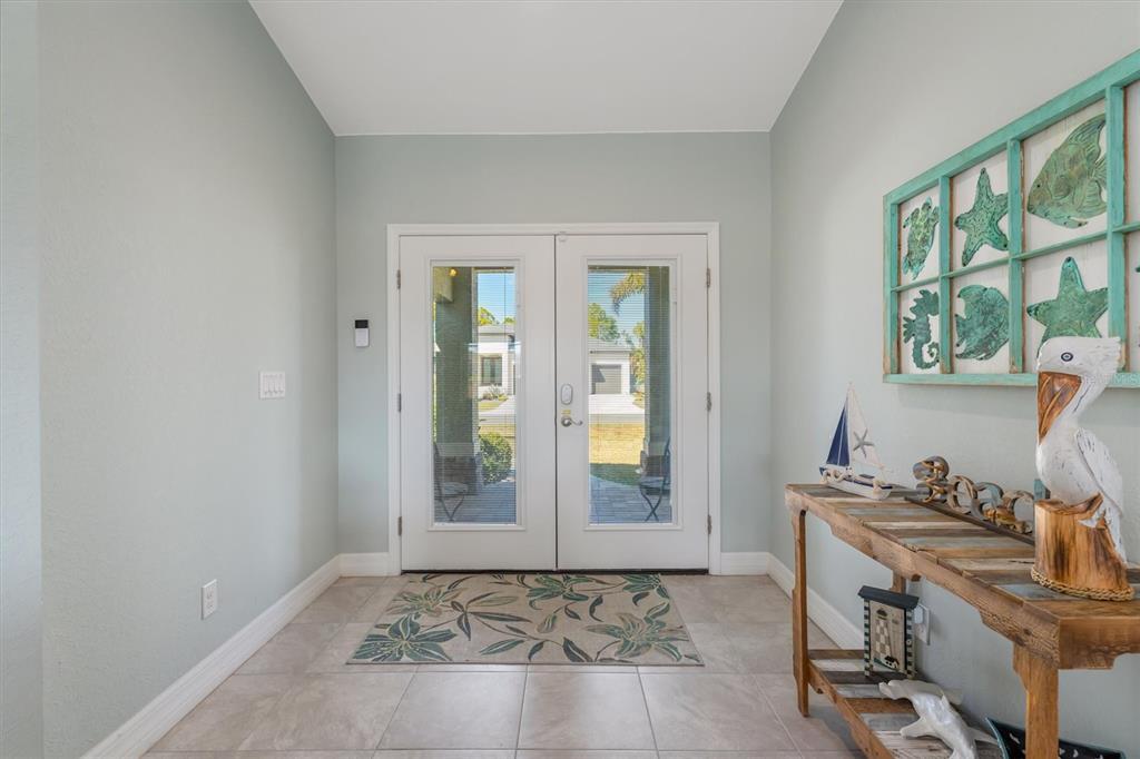 259 Marker Road Rotonda West, FL 33947 - Photo 4 of 37 a view of a workspace with furniture and a window