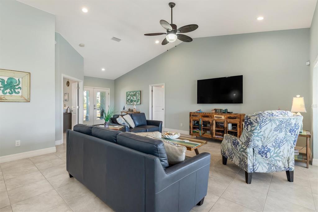 259 Marker Road Rotonda West, FL 33947 - Photo 7 of 37 a living room with furniture and a flat screen tv