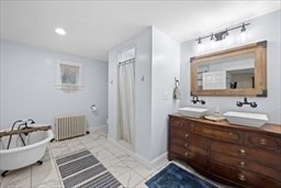 44 Prospect Road Plympton, MA 02367 - Photo 11 of 40 a spacious bathroom with a double vanity sink and a mirror
