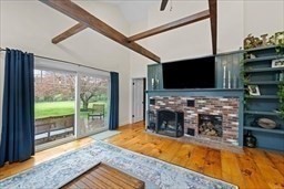 44 Prospect Road Plympton, MA 02367 - Photo 15 of 40 a living room with fireplace furniture and a flat screen tv