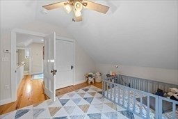 44 Prospect Road Plympton, MA 02367 - Photo 20 of 40 a bedroom with a bed and a chandelier