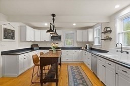 44 Prospect Road Plympton, MA 02367 - Photo 25 of 40 a kitchen with granite countertop kitchen island a stove a sink and a refrigerator