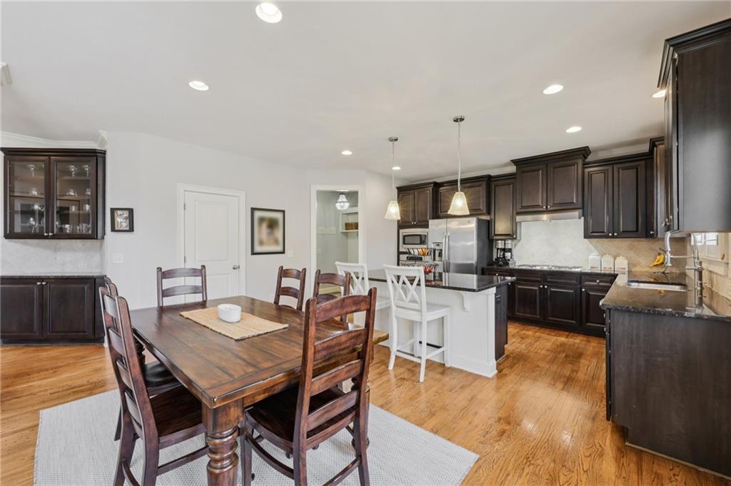 5775 Cascade Trail Cumming, GA 30040 - Photo 11 of 49 a kitchen with a table and chairs in it