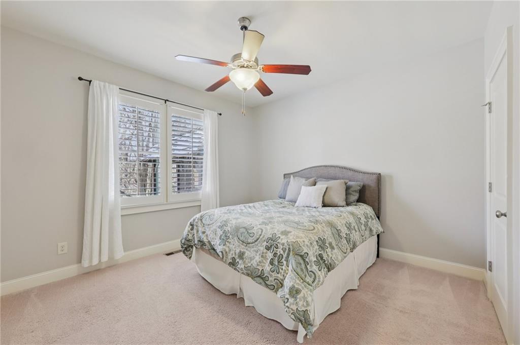 5775 Cascade Trail Cumming, GA 30040 - Photo 15 of 49 a bedroom with a bed and window