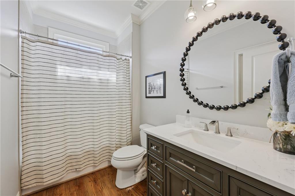 5775 Cascade Trail Cumming, GA 30040 - Photo 16 of 49 a bathroom with a sink a toilet and mirror