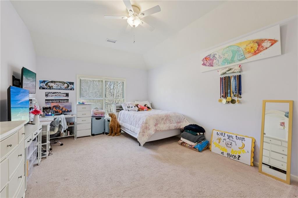 5775 Cascade Trail Cumming, GA 30040 - Photo 22 of 49 a bedroom with furniture and a baby crib