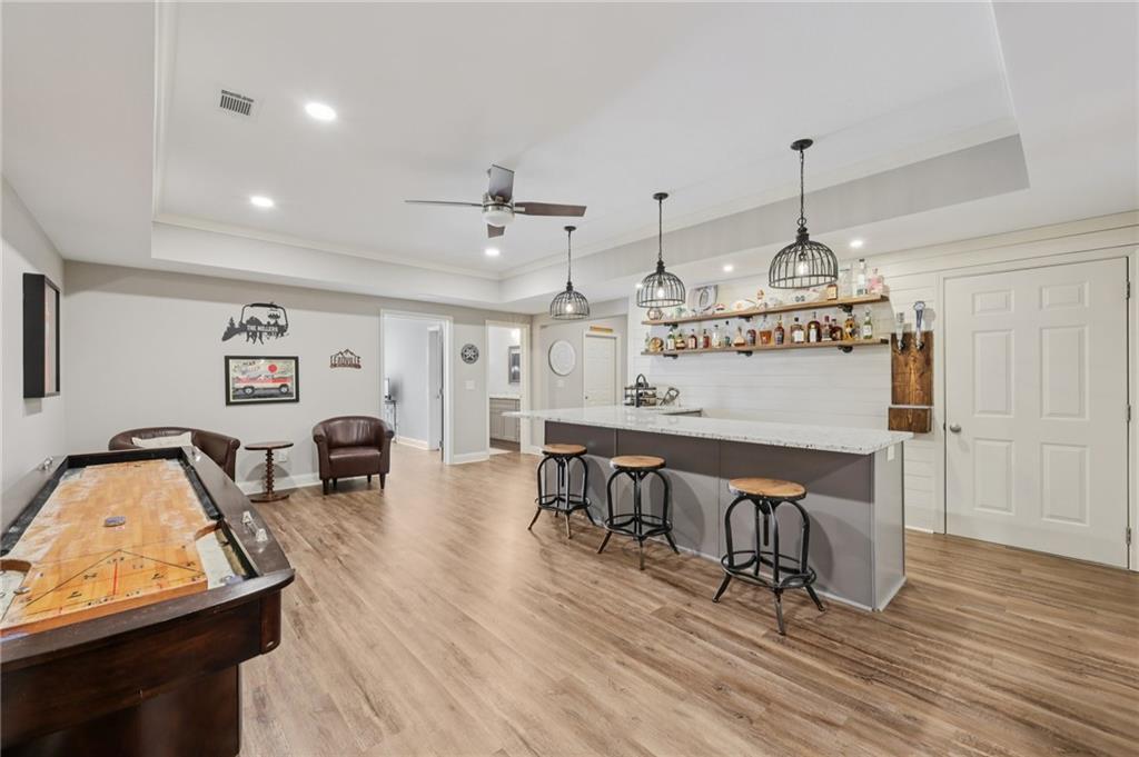 5775 Cascade Trail Cumming, GA 30040 - Photo 27 of 49 a view of a dining room with furniture window and wooden floor