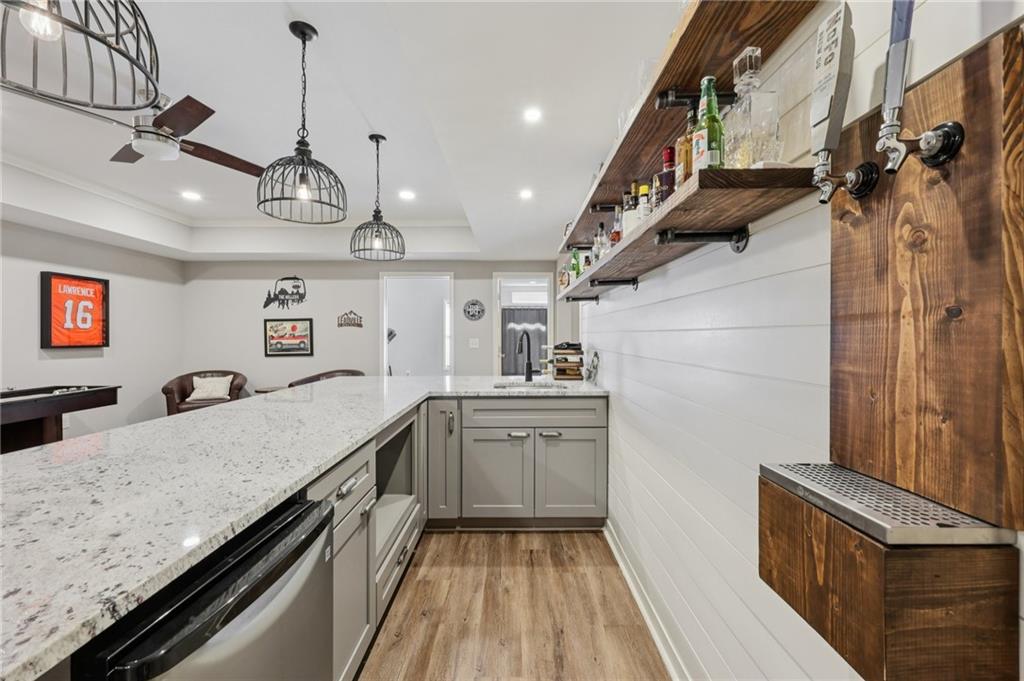 5775 Cascade Trail Cumming, GA 30040 - Photo 28 of 49 a kitchen with stainless steel appliances granite countertop a sink and stove