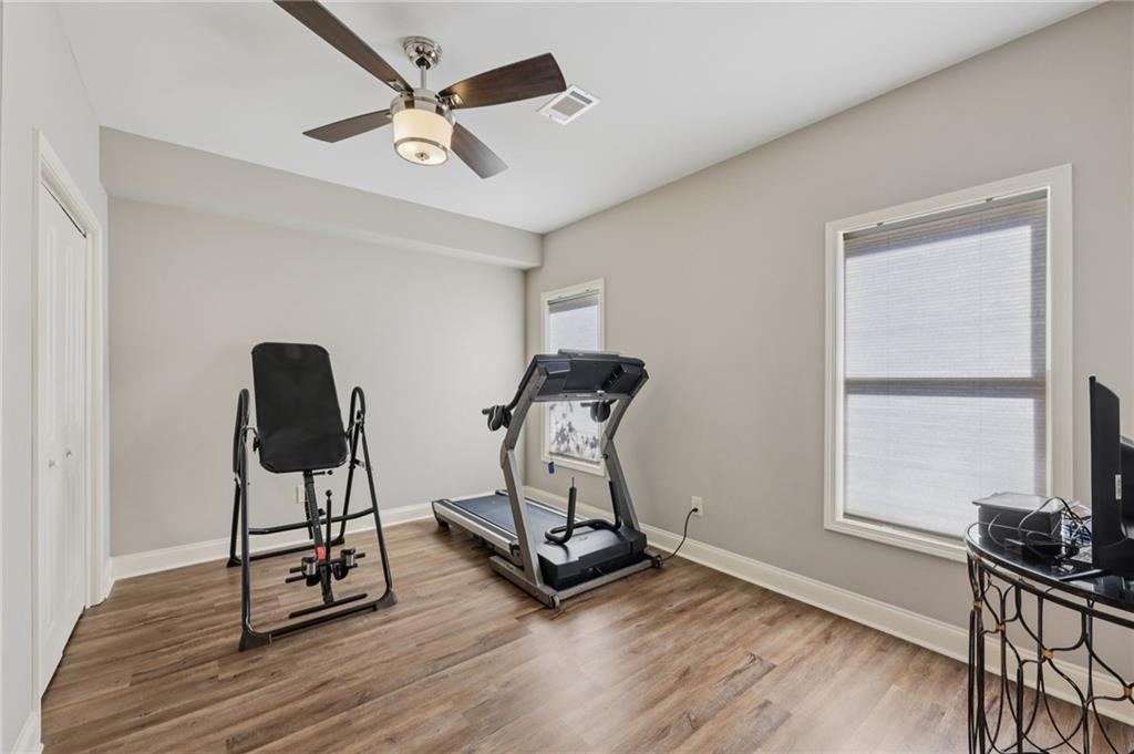 5775 Cascade Trail Cumming, GA 30040 - Photo 31 of 49 a room with gym equipment and windows