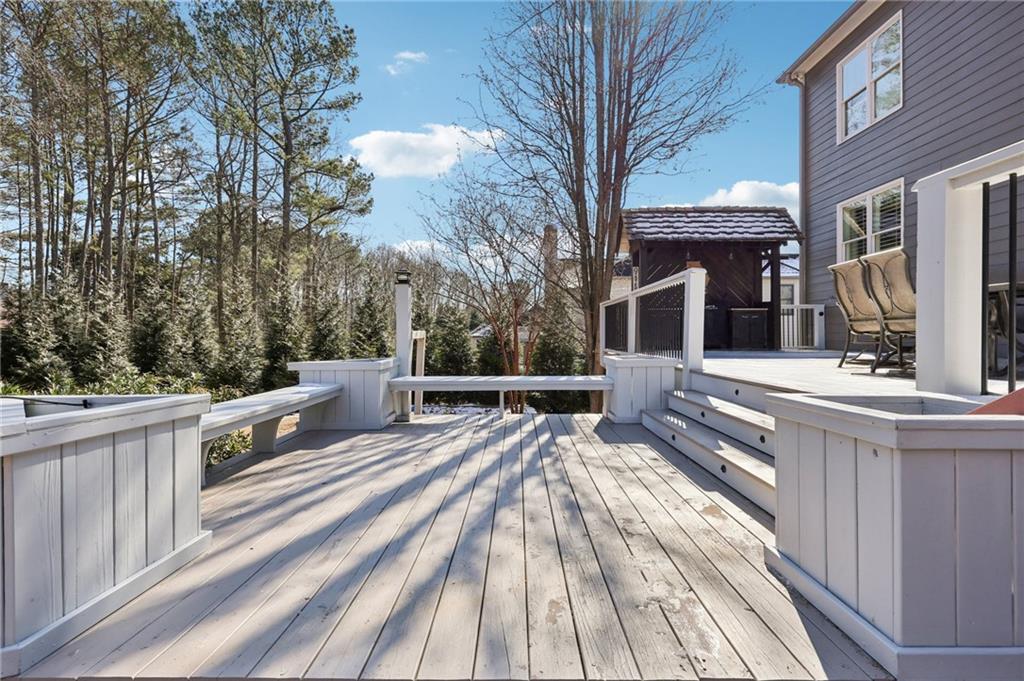 5775 Cascade Trail Cumming, GA 30040 - Photo 35 of 49 a view of a house with backyard and sitting area