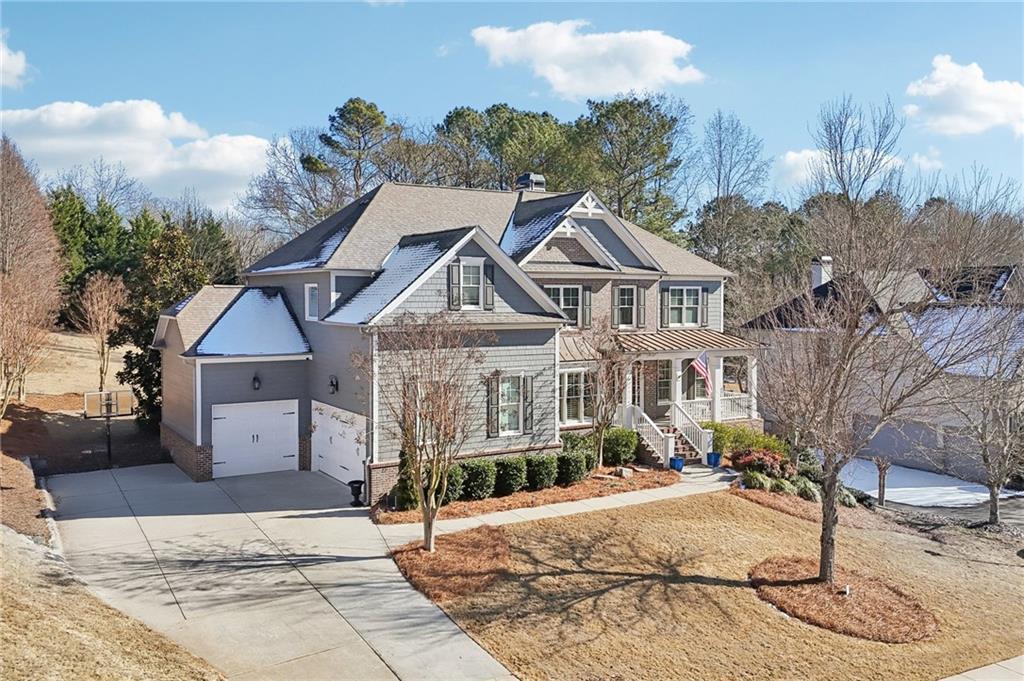 5775 Cascade Trail Cumming, GA 30040 - Photo 38 of 49 a front view of a house with a yard and garage