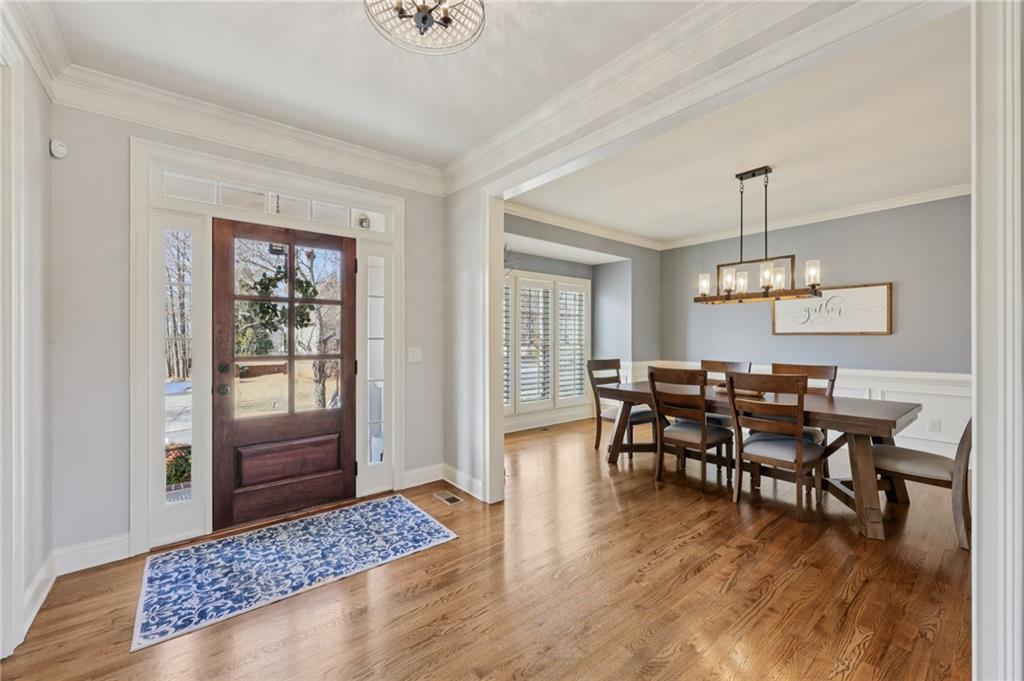 5775 Cascade Trail Cumming, GA 30040 - Photo 4 of 49 a view of a dining room with furniture window and wooden floor