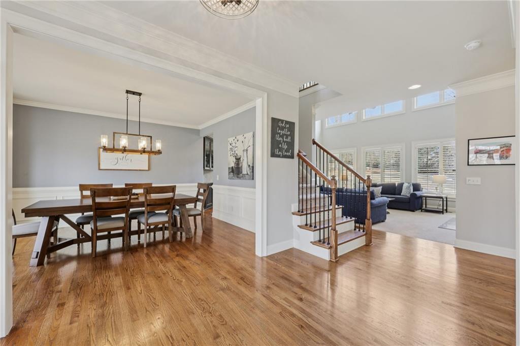 5775 Cascade Trail Cumming, GA 30040 - Photo 6 of 49 a view of a dining room with furniture wooden floor and chandelier